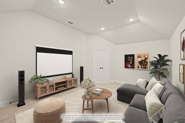 carpeted home theater with lofted ceiling