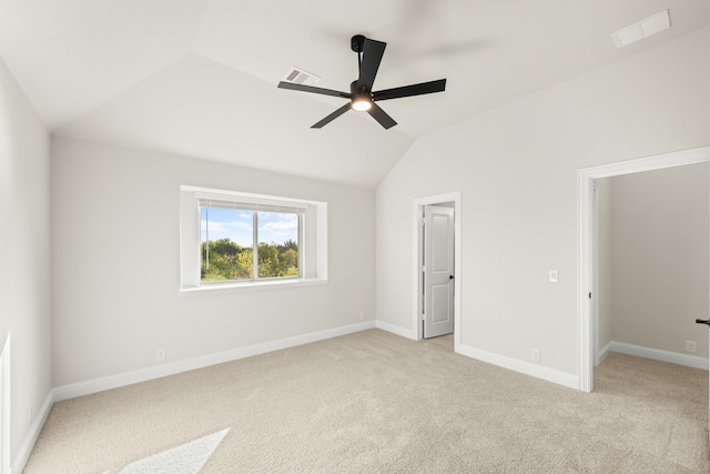 unfurnished bedroom featuring light carpet, ceiling fan, and lofted ceiling