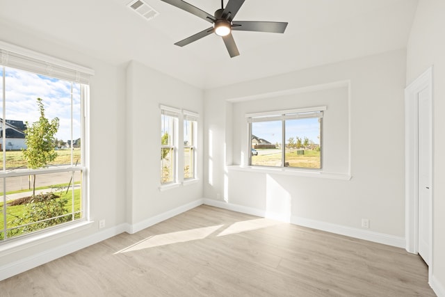 unfurnished room featuring ceiling fan and light wood-type flooring