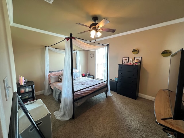 carpeted bedroom with ornamental molding and ceiling fan