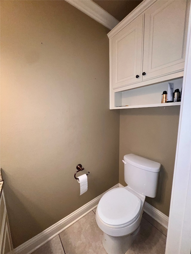 bathroom with tile patterned flooring and toilet