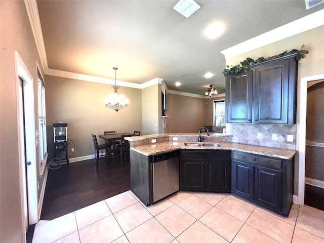 kitchen with sink, stainless steel dishwasher, light tile patterned floors, crown molding, and light stone countertops