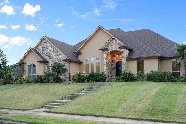 french country home with a front lawn