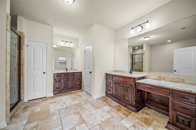 bathroom featuring dual vanity, tile patterned floors, and a shower with door