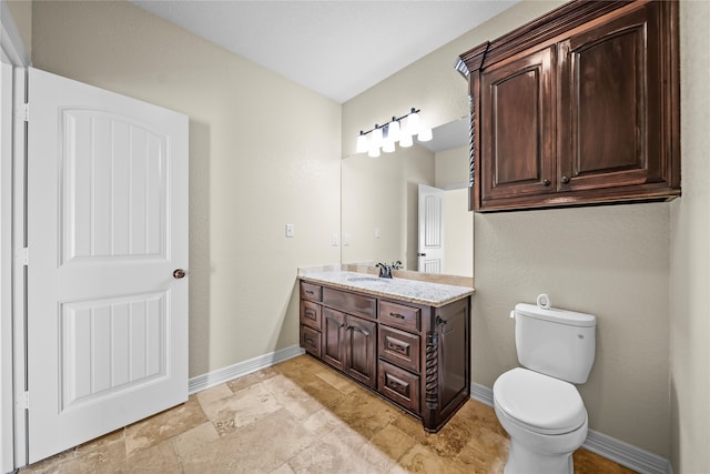 bathroom with tile patterned floors, vanity, and toilet