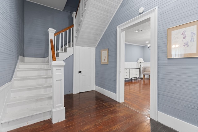 stairway featuring wood-type flooring