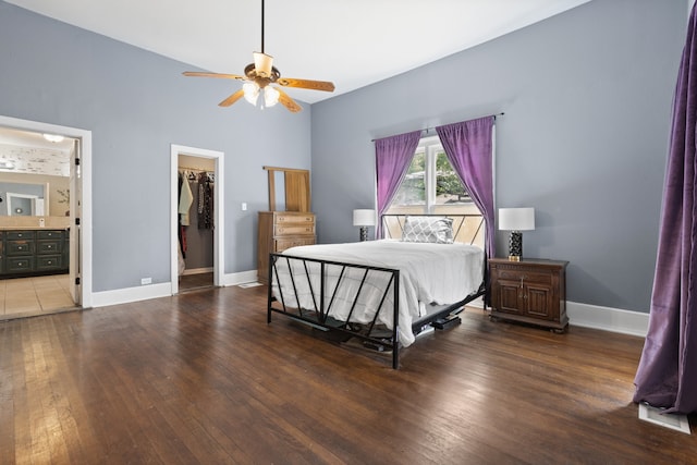 bedroom featuring ensuite bath, ceiling fan, a spacious closet, tile patterned floors, and a closet