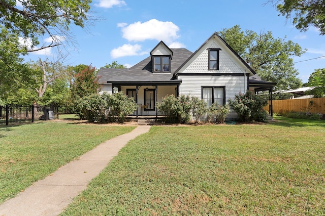 view of front of home featuring a front yard and covered porch