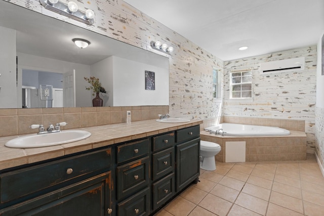 bathroom featuring an AC wall unit, a sink, a bath, and tile patterned floors