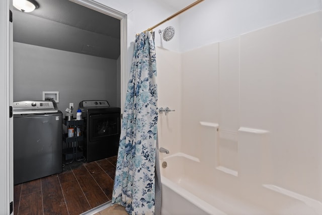 bathroom with shower / tub combo, independent washer and dryer, and wood-type flooring