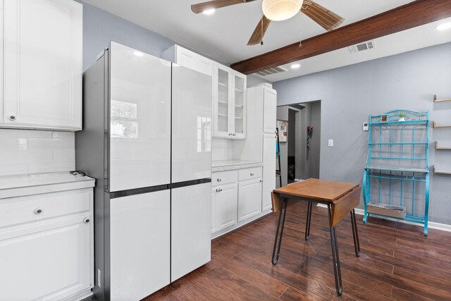 kitchen with ceiling fan, dark hardwood / wood-style flooring, white fridge, and white cabinets