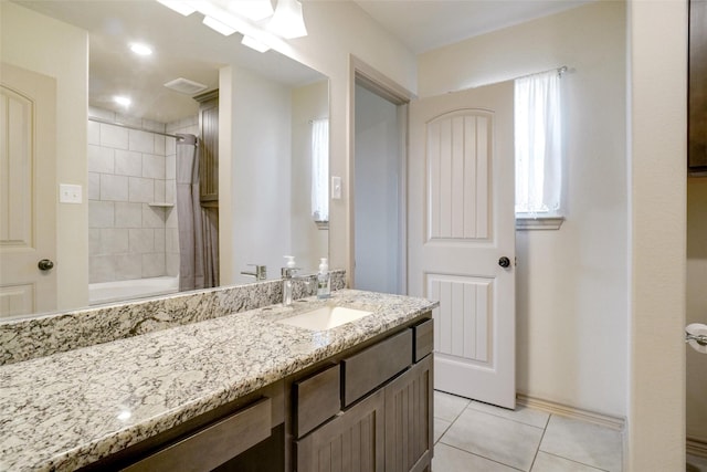 bathroom with tile patterned flooring, vanity, and shower / bath combo