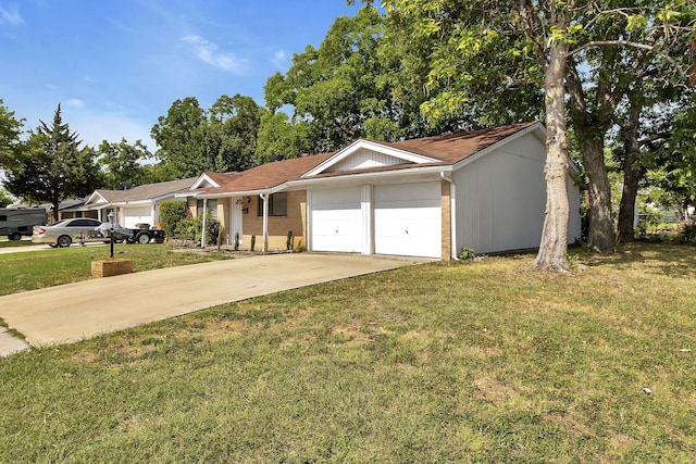 ranch-style home with a garage and a front lawn