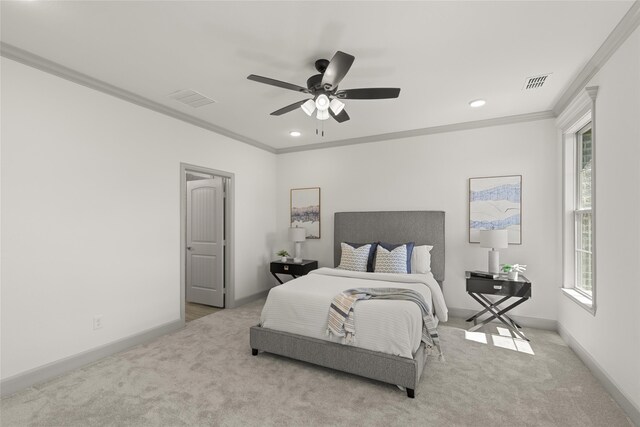 bedroom with crown molding, light carpet, and ceiling fan