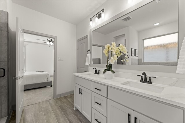 bathroom featuring an enclosed shower, ceiling fan, hardwood / wood-style flooring, and vanity