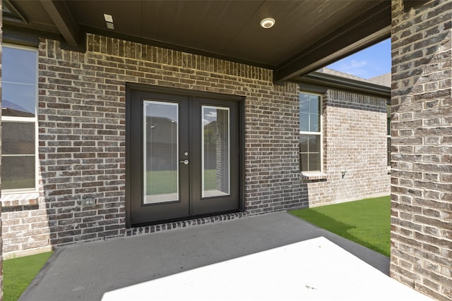 entrance to property with french doors and a patio area