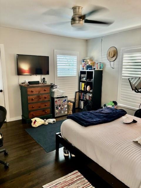 bedroom featuring ceiling fan and dark hardwood / wood-style flooring