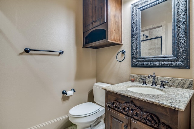 bathroom with toilet and vanity