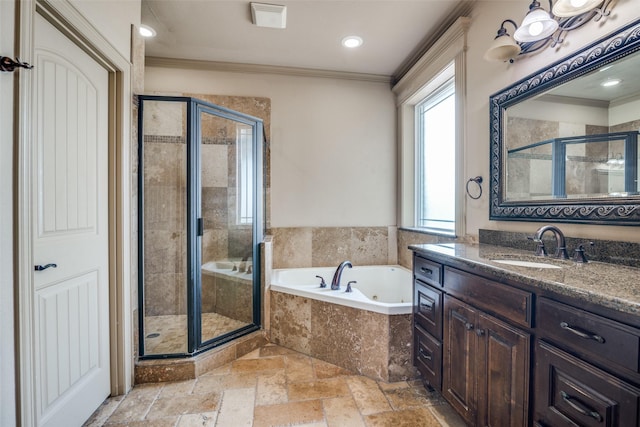 bathroom with separate shower and tub, vanity, and ornamental molding