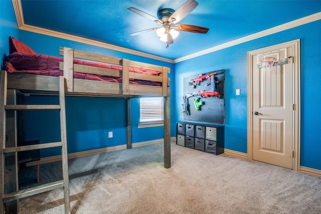 bedroom featuring ceiling fan, ornamental molding, and carpet floors