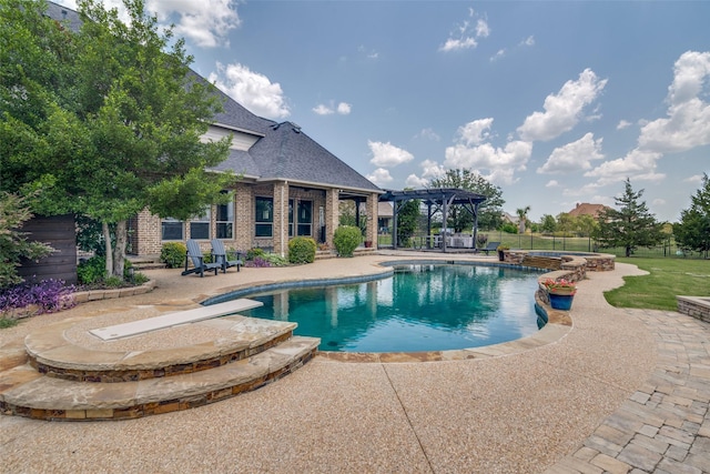 view of swimming pool with a patio area and a pergola