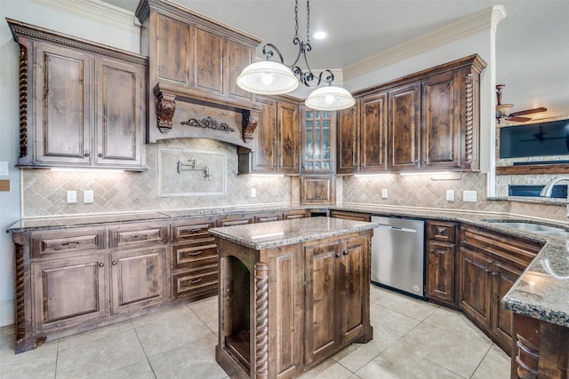 kitchen featuring ceiling fan with notable chandelier, pendant lighting, a center island, sink, and stainless steel dishwasher