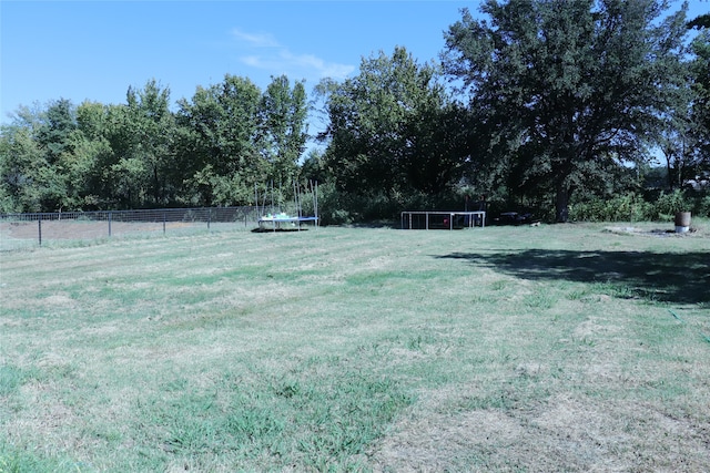 view of yard with a trampoline