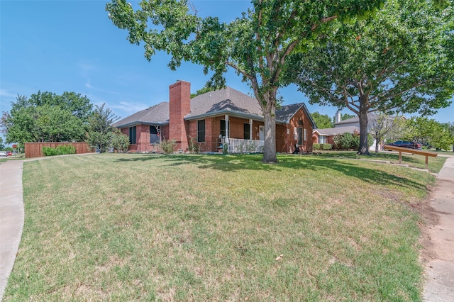 ranch-style house featuring a front lawn