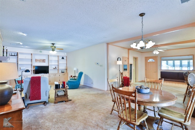 carpeted dining area with ceiling fan with notable chandelier, a textured ceiling, and ornamental molding