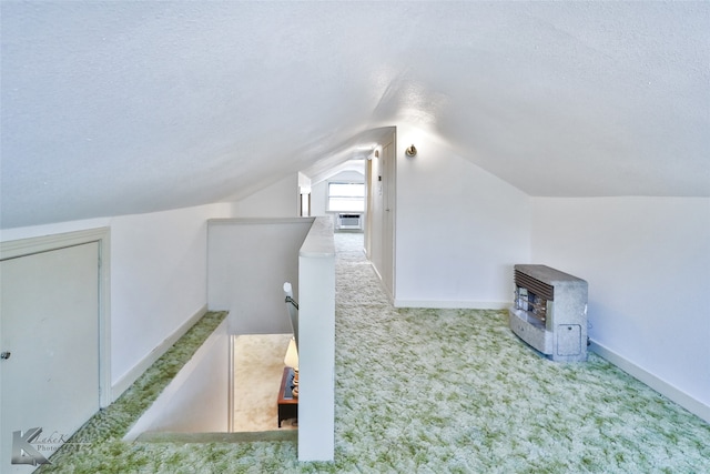 bonus room with cooling unit, light colored carpet, a textured ceiling, and vaulted ceiling