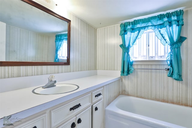 bathroom featuring vanity and a bathing tub