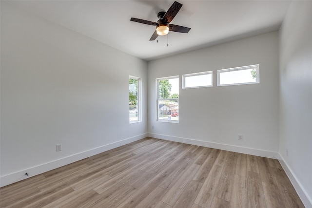 unfurnished room featuring light hardwood / wood-style floors and ceiling fan