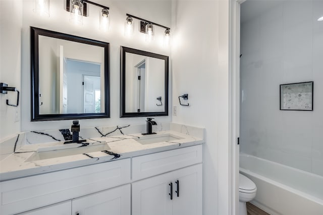 full bathroom featuring double vanity, toilet, and shower / tub combination