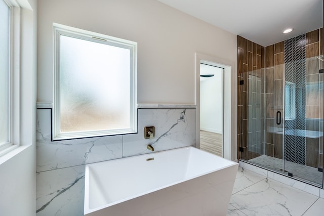 bathroom with plus walk in shower and tile patterned floors