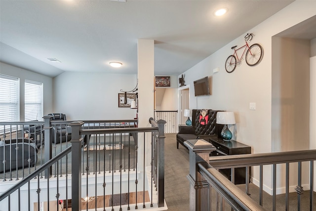 interior space featuring vaulted ceiling and carpet floors