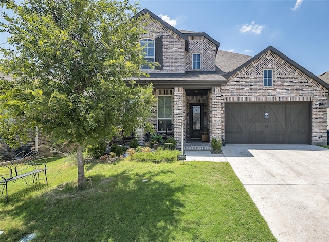 view of front of house featuring a porch, a garage, and a front lawn