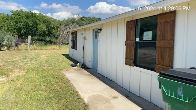 view of home's exterior with a lawn