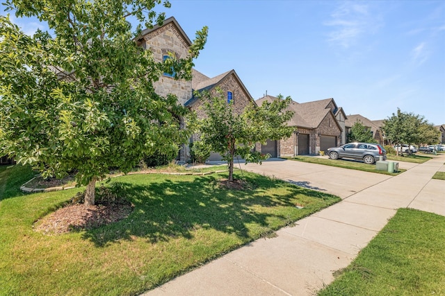 view of front of property with a front lawn and a garage