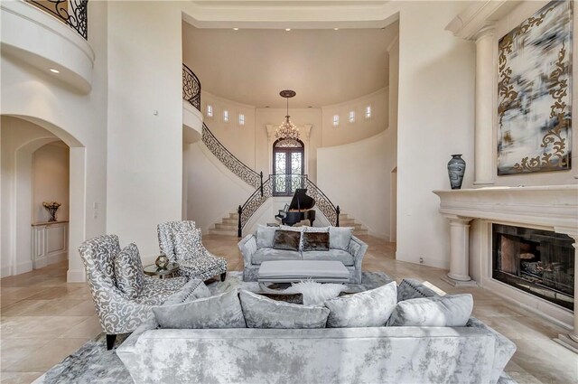 tiled living room with a towering ceiling