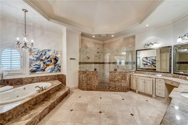 bathroom featuring plus walk in shower, vanity, tile patterned floors, a tray ceiling, and ornamental molding