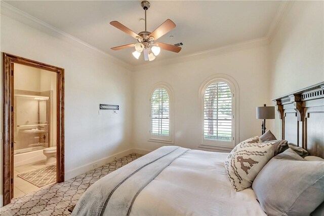 tiled bedroom featuring crown molding, ensuite bath, and ceiling fan