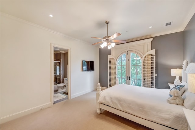 carpeted bedroom with ornamental molding, ensuite bath, ceiling fan, and french doors