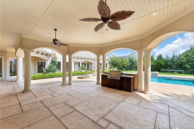 view of patio with grilling area, exterior kitchen, and ceiling fan