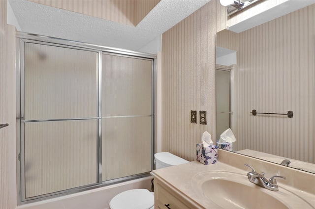 1972 Farm Rd Unit 3134, Cumby, TX 75433 - bathroom featuring toilet, vanity, combined bath / shower with glass door, and a textured ceiling