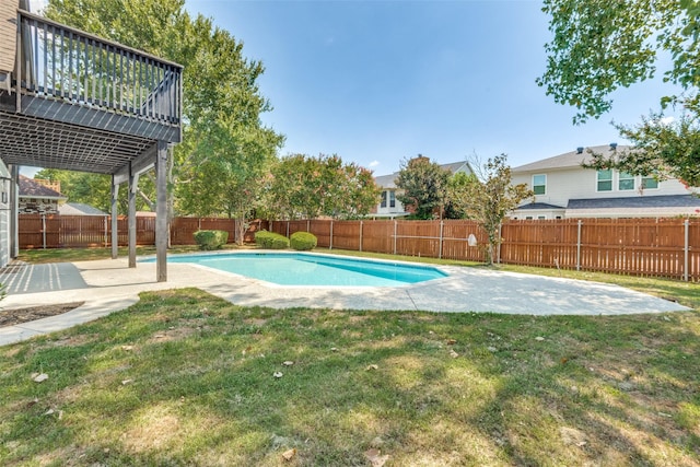 view of swimming pool featuring a patio area, a fenced backyard, a fenced in pool, and a lawn