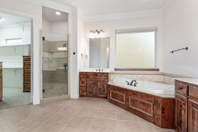 bathroom with vanity, tile patterned floors, independent shower and bath, and crown molding