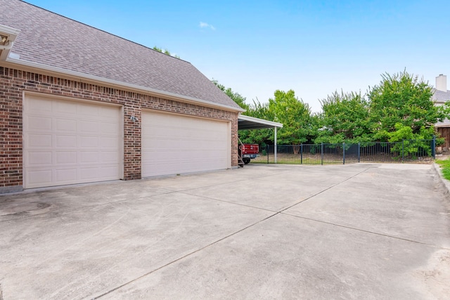 garage featuring a carport