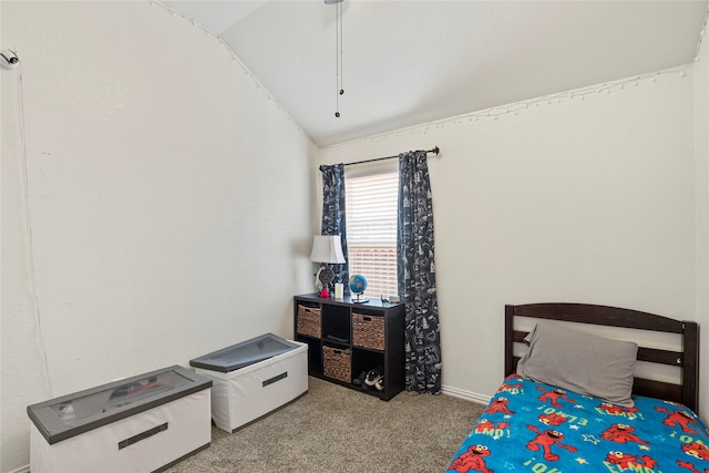 bedroom with vaulted ceiling and carpet floors