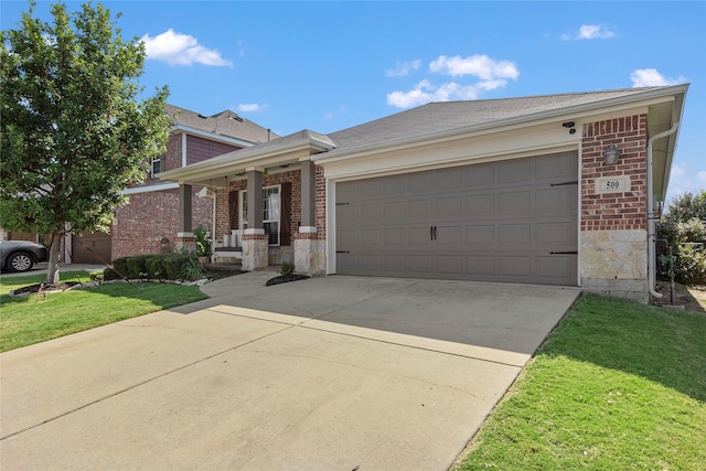 ranch-style house with a garage and a front lawn