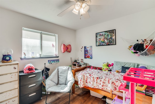 bedroom with hardwood / wood-style flooring and ceiling fan